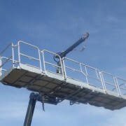 Personnel cage with crane
